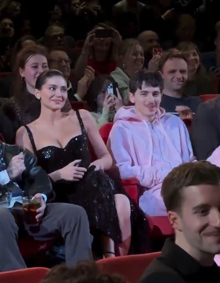 Kylie Jenner and Timothée Chalamet at a Valentine's Day red carpet event, drawing attention from the crowd.